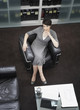 Businesswoman sitting in office smiling