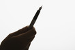Hand holding a pen
