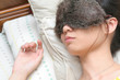 Young lady sound asleep with night eyeshades on