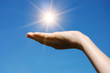 hand hold against blue sky hand hold against blue sky