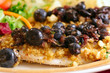 Close-up of croton-crusted tilapia with blueberry topping