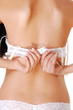Woman closing her bra.