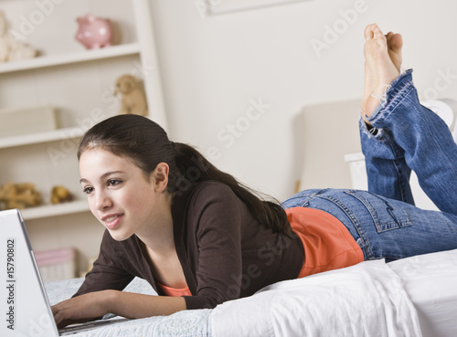 Photo: Happy Teenage Girl on computer Happy Teenage Girl on computer