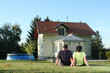 Couple in front of house