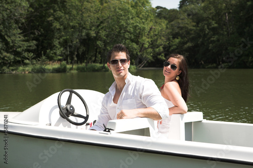 Photo: Young attractive couple on boat Young attractive couple on boat