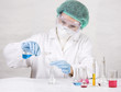 Scientist hands holding two glass testtubes