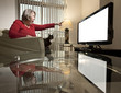 Woman pointing at blank TV screen