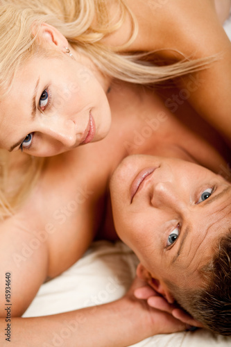 Photo: portrait of semi nude couple laying in bed portrait of semi nude couple laying in bed