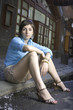 Girl sitting on a curb Girl sitting on a curb