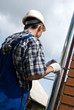 Man installing  rain gutter system