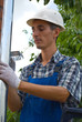 Man installing  rain gutter system