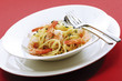 Spaghetti with prawns on plate