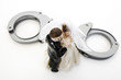 Wedding couple figurines and handcuff