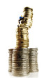 Figurine climbing pile of coins
