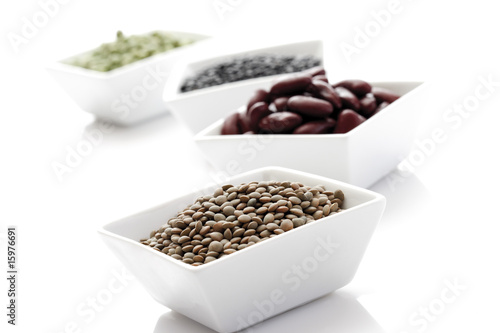 Photo: Lintils and beans in bowls, close-up Lintils and beans in bowls, close-up