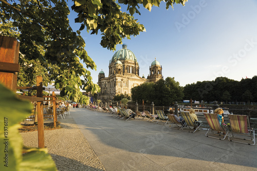 Photo: Germany, Berlin, Cathedral, People on canvas chairs in foreground Germany, Berlin, Cathedral, People on canvas chairs in foreground