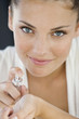 Woman applying perfume