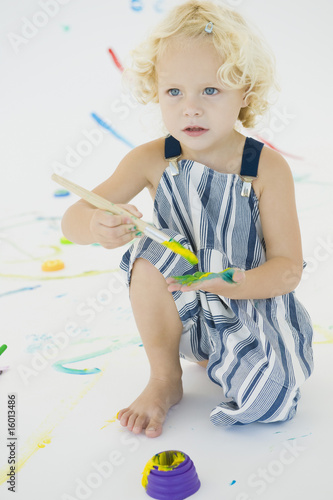 Photo: Girl painting on her palm Girl painting on her palm