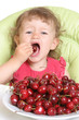 child tastes cherry