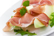 Prosciutto di Parma ham and three slice of melon Prosciutto di Parma ham and three slice of melon