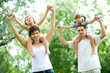Couple giving children piggyback rides