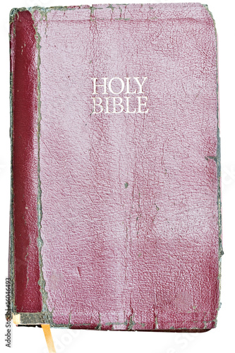 Photo: Old tattered Holy Bible . Clipping path included. Old tattered Holy Bible . Clipping path included.