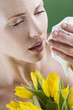 Close-up of a young woman sneezing