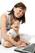 Mother and baby with laptop isolated on white