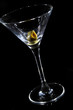 Olive on a martini glass