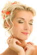 Beautiful young woman with fresh spring flowers in her hair