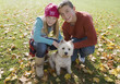 Young boy and young girl outdoors with a dog