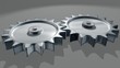 Interlocking gears turning showing teamwork concept