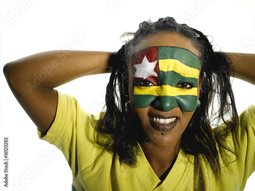 Photo: Woman with Togo flag painted on face, close-up, portrait Woman with Togo flag painted on face, close-up, portrait