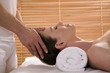 Woman receiving facial massage