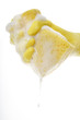 Photo: Hand wringing out sponge, close up Hand wringing out sponge, close up