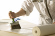 Woman pastes wallpaper