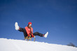 Young woman riding sledge