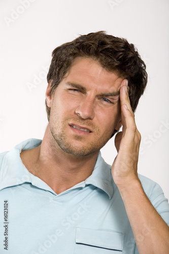 Photo: Young man with head in hands, close-up, portrait Young man with head in hands, close-up, portrait