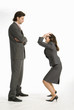Businesswoman laughing at businessman, side view
