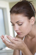 Woman smelling soap