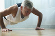 Man in gym doing push-ups