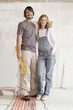 Young couple in an unfinished building, portrait