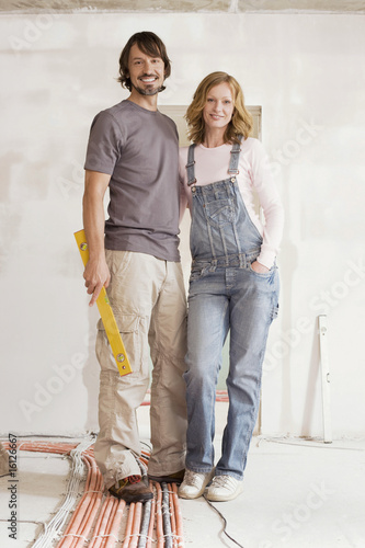 Photo: Young couple in an unfinished building, portrait Young couple in an unfinished building, portrait
