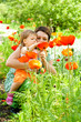 Mother showing flowers to daughter Mother showing flowers to daughter