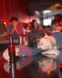 Man passed out on bar in nightclub
