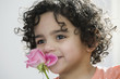 Photo: Pretty child smelling a flower Pretty child smelling a flower