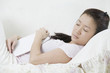 Asian woman relaxing with a book