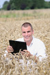 Agriculture scientist in the field with notepad