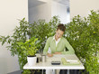 Businesswoman working at desk surrounded by plants