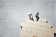 Couple building house outline on sidewalk